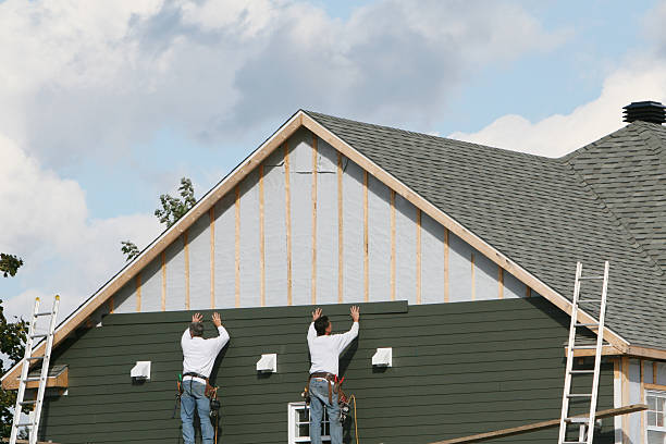 Professional Siding technician working in Foster, VA